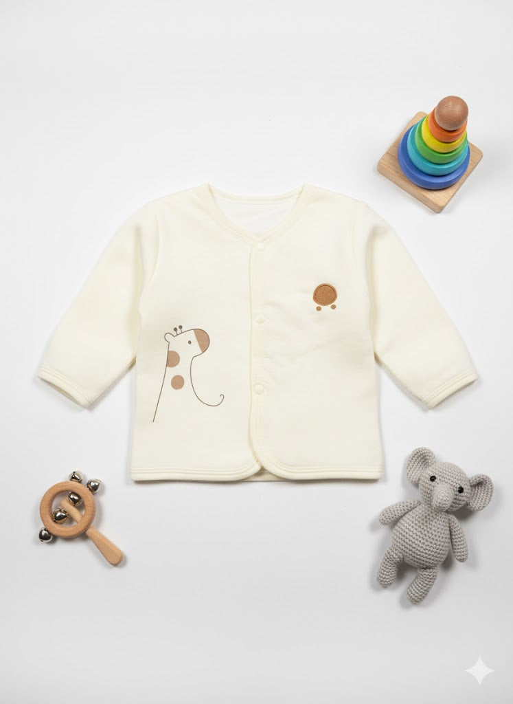 Baby outfit with long-sleeve shirt, toys, and a white background